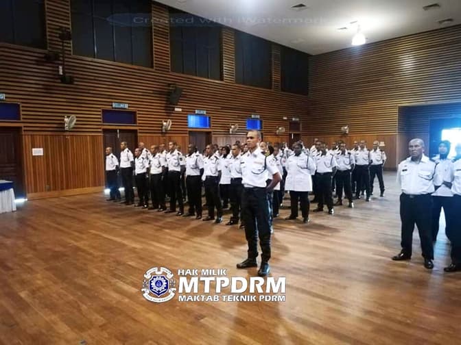 Taqwa Teguh officers in formation during a briefing